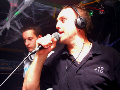 Lil' Bri on the mic at one of his +12 nights
